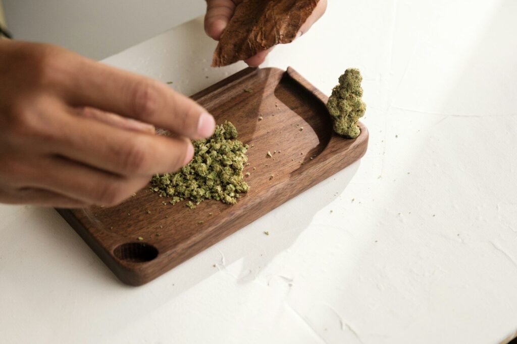 a person cutting broccoli